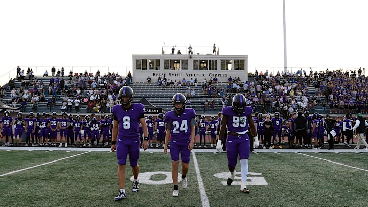 Lipscomb Academy's Tav Shaffer (8), Brennan Pepper (24), and Tony Carter (99) walk to midfield for the coin flip during an high school football game against First Academy Thursday, Aug. 22, 2024, in Nashville, Tenn.