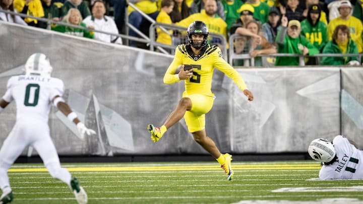 Oregon Ducks quarterback Dante Moore runs the ball as the Ducks host the Spartans Friday, Oct. 4, 2024 at Autzen Stadium in Eugene, Ore.