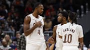 Dec 12, 2025; Washington, District of Columbia, USA; Cleveland Cavaliers guard Donovan Mitchell (45) talks with Cavaliers center Evan Mobley (4) and Cavaliers guard Darius Garland (10) during a stoppage in play against the Washington Wizards in the second half at Capital One Arena. Mandatory Credit: Geoff Burke-Imagn Images
