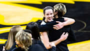 Iowa guard Caitlin Clark (22) embraces Iowa associate head coach Jan Jensen after a Cy-Hawk series NCAA non-conference women's basketball game at Carver-Hawkeye Arena in Iowa City, Iowa.