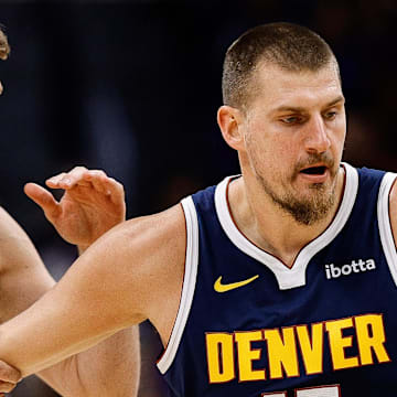 Nov 3, 2025; Denver, Colorado, USA; Denver Nuggets center Nikola Jokic (15) dribbles the ball up court as Sacramento Kings forward Domantas Sabonis (11) defends in the first quarter at Ball Arena. Mandatory Credit: Isaiah J. Downing-Imagn Images