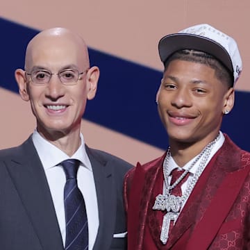 Jun 25, 2025; Brooklyn, NY, USA;  Jeremiah Fears stands with NBA commissioner Adam Silver after being selected as the seventh pick by the New Orleans Pelicans in the first round of the 2025 NBA Draft at Barclays Center. Mandatory Credit: Brad Penner-Imagn Images
