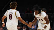 Dec 6, 2025; Phoenix, Arizona, USA; Arizona State University Sun Devils forward Allen Mukeba (23) high fives Arizona State University Sun Devils forward Marcus Adams Jr. (8) against Oklahoma University Sooners in the first half at PHX Arena. Mandatory Credit: Anna Carrington-Imagn Images