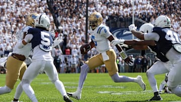 Oct 5, 2024; University Park, Pennsylvania, USA; UCLA Bruins quarterback Jaylin Davies (6) runs with the ball during the second quarter against the Penn State Nittany Lions at Beaver Stadium. Mandatory Credit: Matthew O'Haren-Imagn Images