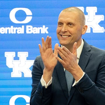 University of Kentucky’s new men’s basketball coach Mark Pope applauds as Athletic Director Mitch Barnhart introduces him to the thousands of fans in Rupp Arena for his press conference on Sunday, April 14, 2024.