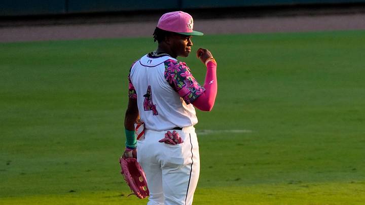 Apr 18, 2025; North Augusta, South Carolina, USA; Augusta GreenJackets Isaiah Drake (4) stands in the outfield during the Augusta GreenJackets and Myrtle Beach baseball game at SRP Park. The Augusta GreenJackets unveiled their new Augusta Azalea uniforms. Mandatory Credit: Katie Goodale - Augusta Chronicle/USA TODAY NETWORK