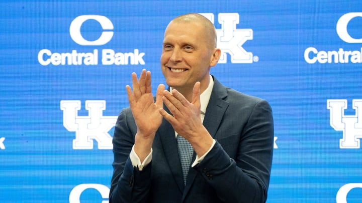 University of Kentucky’s new men’s basketball coach Mark Pope applauds as Athletic Director Mitch Barnhart introduces him to the thousands of fans in Rupp Arena for his press conference on Sunday, April 14, 2024.