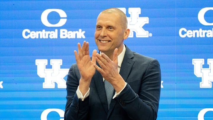 University of Kentucky’s new men’s basketball coach Mark Pope applauds as Athletic Director Mitch Barnhart introduces him to the thousands of fans in Rupp Arena for his press conference on Sunday, April 14, 2024.