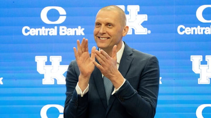 University of Kentucky’s new men’s basketball coach Mark Pope applauds as Athletic Director Mitch Barnhart introduces him to the thousands of fans in Rupp Arena for his press conference on Sunday, April 14, 2024.