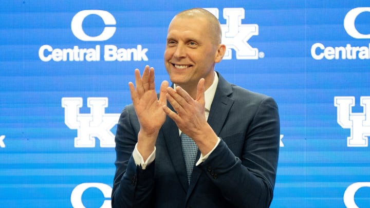 University of Kentucky’s new men’s basketball coach Mark Pope applauds as Athletic Director Mitch Barnhart introduces him to the thousands of fans in Rupp Arena for his press conference on Sunday, April 14, 2024.