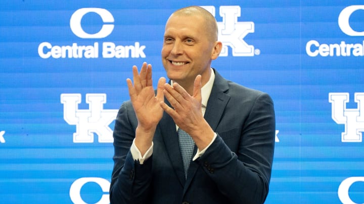 University of Kentucky’s new men’s basketball coach Mark Pope applauds as Athletic Director Mitch Barnhart introduces him to the thousands of fans in Rupp Arena for his press conference on Sunday, April 14, 2024.