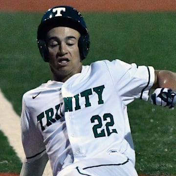 Trinity Christian's Korbyn Dickerson scores during a 7th region championship game against St. Xavier on May 28, 2019, at Eastern High School.