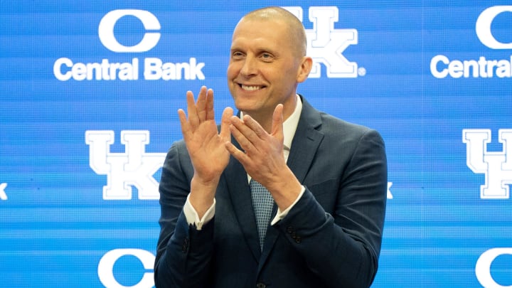 University of Kentucky’s new men’s basketball coach Mark Pope applauds as Athletic Director Mitch Barnhart introduces him to the thousands of fans in Rupp Arena for his press conference on Sunday, April 14, 2024.