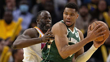 Mar 18, 2025; San Francisco, California, USA; Milwaukee Bucks forward Giannis Antetokounmpo (34) attempts to turn and shoot over Golden State Warriors forward Draymond Green (left) during the fourth quarter at Chase Center. Mandatory Credit: D. Ross Cameron-Imagn Images