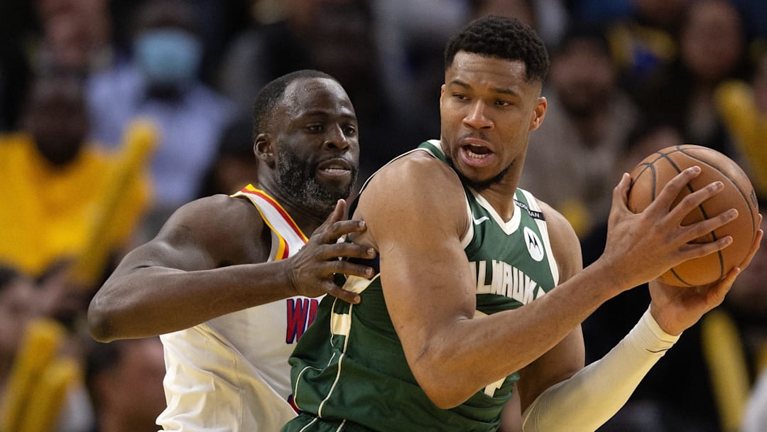 Mar 18, 2025; San Francisco, California, USA; Milwaukee Bucks forward Giannis Antetokounmpo (34) attempts to turn and shoot over Golden State Warriors forward Draymond Green (left) during the fourth quarter at Chase Center. Mandatory Credit: D. Ross Cameron-Imagn Images