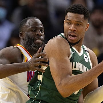 Mar 18, 2025; San Francisco, California, USA; Milwaukee Bucks forward Giannis Antetokounmpo (34) attempts to turn and shoot over Golden State Warriors forward Draymond Green (left) during the fourth quarter at Chase Center. Mandatory Credit: D. Ross Cameron-Imagn Images