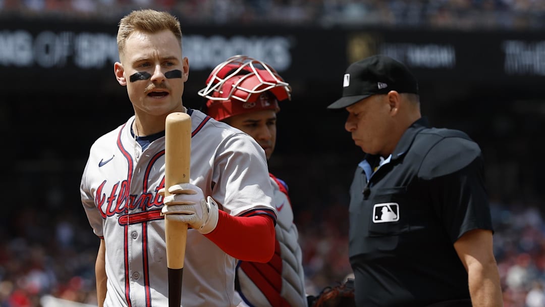 Atlanta Braves left fielder Jarred Kelenic (24) exchanges words with the dugout of the Washington Nationals after avoiding being hit by a pitch.