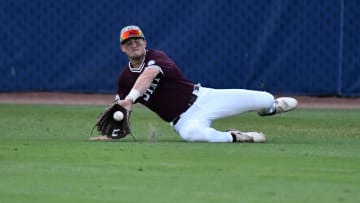 May 24 2024; Hoover, AL, USA; Mississippi State centerfielder Connor Hujsak makes a diving try but fields a single against Tennessee at the Hoover Met during the SEC Tournament.