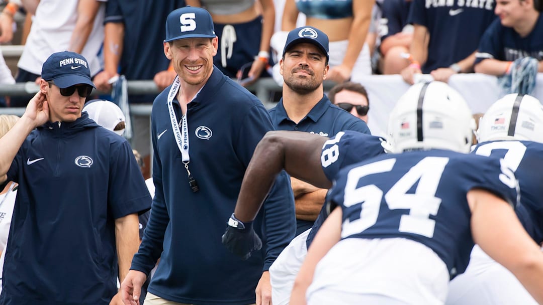 Penn State offensive line coach Phil Trautwein (second from left)