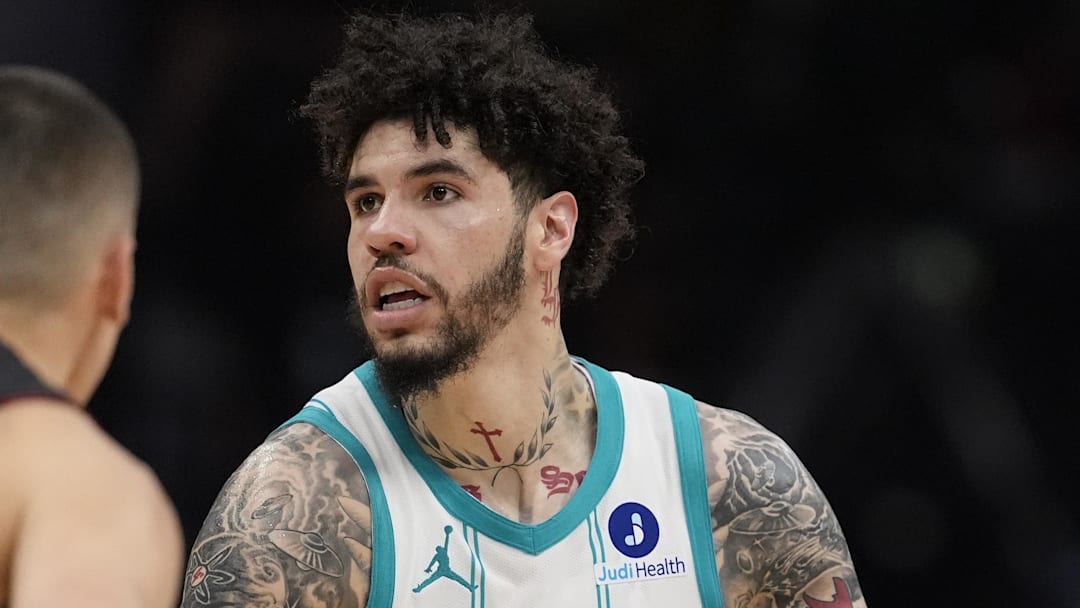 Apr 14, 2026; Charlotte, North Carolina, USA; Charlotte Hornets guard LaMelo Ball (1) looks to pass defended by Miami Heat guard Tyler Herro (14) during the second half during the play-in rounds between the Charlotte Hornets and the Miami Heat of the 2026 NBA Playoffs at Spectrum Center. Mandatory Credit: Jim Dedmon-Imagn Images