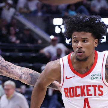 Apr 11, 2024; Salt Lake City, Utah, USA; Houston Rockets guard Jalen Green (4) dribbles past Utah Jazz forward Luka Samanic (19) during the third quarter at Delta Center. Mandatory Credit: Rob Gray-Imagn Images