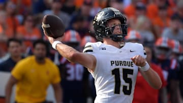 Oct 12, 2024; Champaign, Illinois, USA; Purdue Boilermakers quarterback Ryan Browne (15) passes in the first half against the Illinois Fighting Illini at Memorial Stadium. Mandatory Credit: Ron Johnson-Imagn Images