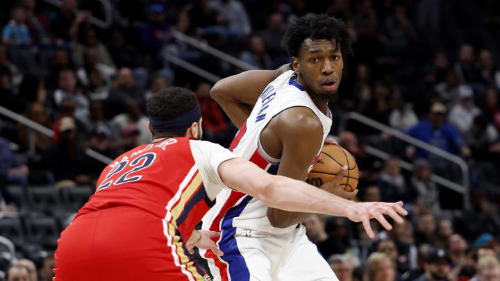 Mar 24, 2024; Detroit, Michigan, USA;  Detroit Pistons center James Wiseman (13) is defended by New Orleans Pelicans forward Larry Nance Jr. (22) in the second half at Little Caesars Arena. Mandatory Credit: Rick Osentoski-USA TODAY Sports