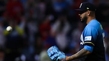 Apr 18, 2025; Philadelphia, Pennsylvania, USA; Philadelphia Phillies pitcher Jose Ruiz catches the game winning ball after a victory against the Miami Marlins at Citizens Bank Park. 