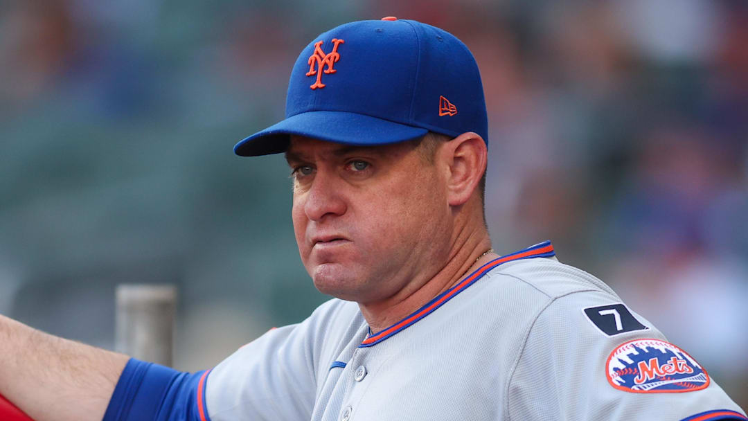 Jun 19, 2025; Atlanta, Georgia, USA; New York Mets manager Carlos Mendoza (64) in the dugout before a game against the Atlanta Braves at Truist Park. Mandatory Credit: Brett Davis-Imagn Images