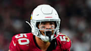 Cardinals linebacker Cody Simon (50) looks over the Raiders' offensive line during a preseason game at State Farm Stadium in Glendale on Aug. 23, 2025.