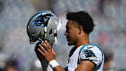 Sep 28, 2025; Foxborough, Massachusetts, USA; Carolina Panthers quarterback Bryce Young (9) puts on his helmet during warmups before a game against the New England Patriots at Gillette Stadium.