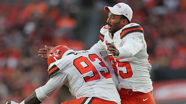 Cleveland Browns defensive ends Myles Garrett celebrates with Trevon Coley after the Redskins failed to convert on third down