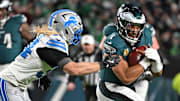 Philadelphia Eagles quarterback Jalen Hurts (1) is tackled by Detroit Lions linebacker Alex Anzalone (34) 