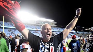 Nov 25, 2022; Chapel Hill, North Carolina, USA; North Carolina State Wolfpack head coach Dave Doeren  celebrates after the game at Kenan Memorial Stadium. Mandatory Credit: Bob Donnan-Imagn Images