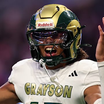 Senior quarterback Travis Burgess, a UNC commit, accounted for four touchdowns in the rain on Friday as No. 1 Grayson dismantled No. 7 Collins Hill 51-3 in a Georgia high school season opener.