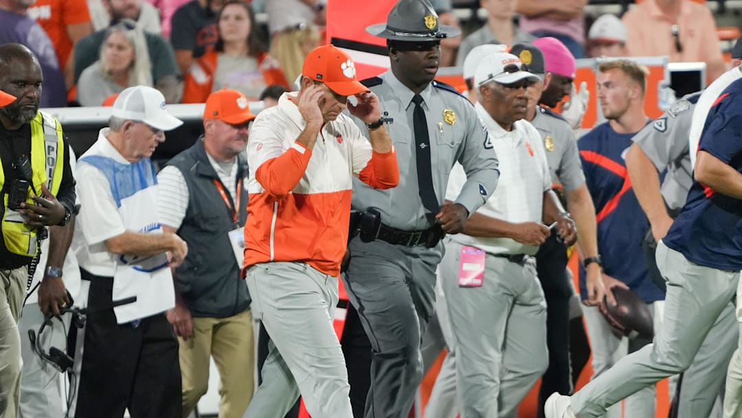Oct 18, 2025; Clemson, South Carolina, USA; Clemson Tigers head coach Dabo Swinney walks over to meet Southern Methodist Mustangs head coach Rhett Lashlee (not shown) after the game at Memorial Stadium. Mandatory Credit: Ken Ruinard-GREENVILLE NEWS-USA TODAY Network via Imagn Images