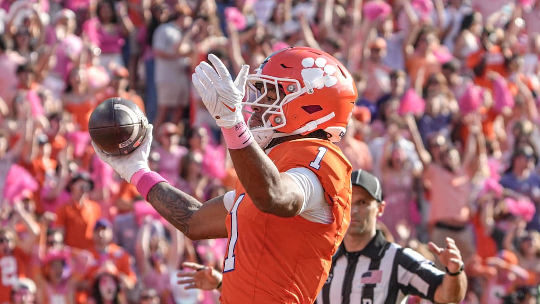 Oct 18, 2025; Clemson, South Carolina, USA; Clemson Tigers wide receiver T.J. Moore (1) celebrates his 32-yard touchdown catch against the Southern Methodist Mustangs during the second quarter at Memorial Stadium. Mandatory Credit: Ken Ruinard-GREENVILLE NEWS-USA TODAY Network via Imagn Images