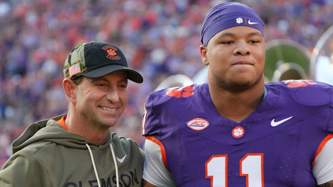 Clemson head coach Dabo Swinney with defensive lineman Peter Woods (11) before kickoff with Furman University at Memorial Stadium in Clemson, SC, Saturday, November 22, 2025.