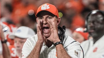 Clemson head coach Dabo Swinney communicates with a referee in the game with Louisiana State University during the second quarter at Memorial Stadium in Clemson, S.C., Saturday, Aug 30, 2025.