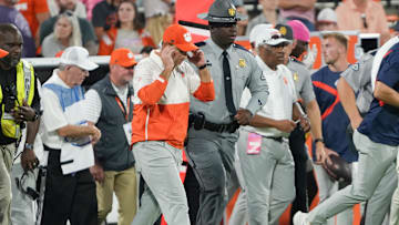 Oct 18, 2025; Clemson, South Carolina, USA; Clemson Tigers head coach Dabo Swinney walks over to meet Southern Methodist Mustangs head coach Rhett Lashlee (not shown) after the game at Memorial Stadium. Mandatory Credit: Ken Ruinard-GREENVILLE NEWS-USA TODAY Network via Imagn Images