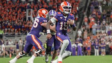 Clemson quarterback Chris Denson (15) runs by Furman players during the fourth quarter at Memorial Stadium in Clemson, S.C. Saturday, November 22, 2025.