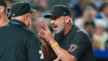 Jul 22, 2024; Kansas City, Missouri, USA; Arizona Diamondbacks manager Torey Lovullo (17) talks with umpire Brian O'Nora (7) during the seventh inning against the Kansas City Royals at Kauffman Stadium. Mandatory Credit: Jay Biggerstaff-USA TODAY Sports