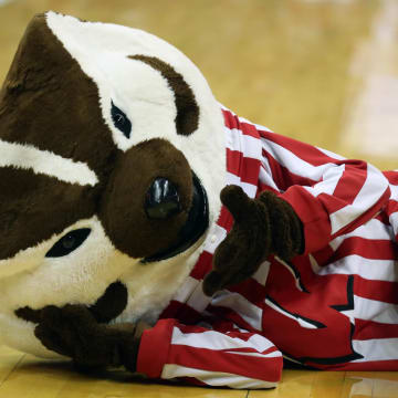 Dec 29, 2021; Madison, Wisconsin, USA; Wisconsin Badgers mascot Bucky Badger plays around on the court before the game with the Illinois State Redbirds at the Kohl Center. Mandatory Credit: Mary Langenfeld-USA TODAY Sports