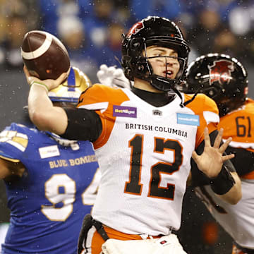 Nov 13, 2022; Winnigeg, Manitoba, CAN; BC Lions quarterback Nathan Rourke (12) throws against the Winnipeg Blue Bombers in the first half at Investors Group Field. Mandatory Credit: James Carey Lauder-Imagn Images