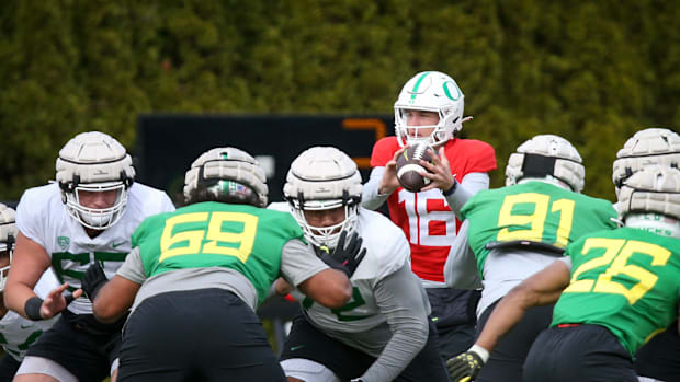 Oregon quarterback Austin Novosad takes a snap during spring practice with the Ducks in Eugene, Ore. Thursday, April, 13, 202