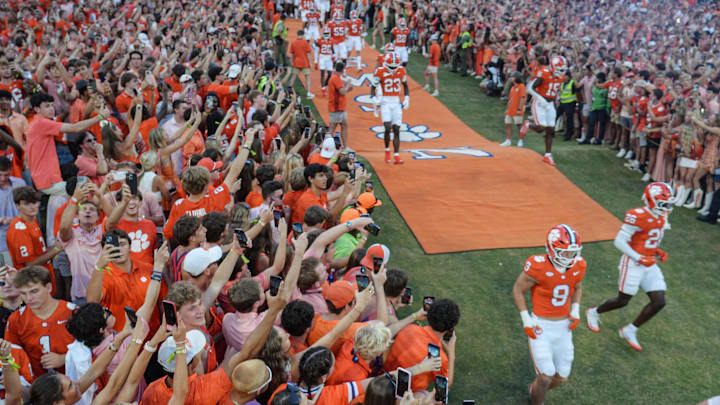 Clemson football players run down the hill before the game with Clemson and Louisiana State University at Memorial Stadium in Clemson, S.C. Saturday, August 30, 2025.