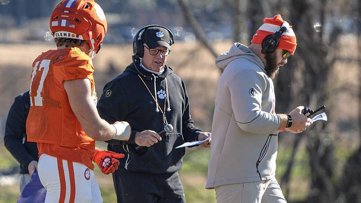 Clemson defensive coordinator Tom Allen talks near Clemson linebacker Wade Woodaz (17), left, and Clemson linebackers coach Ben Boulware during the Pinstipe Bowl practice in Clemson, S.C. Monday, Dec. 15, 2025.