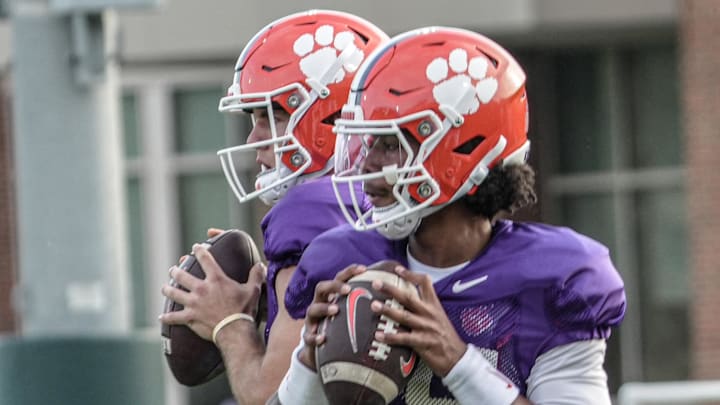 Clemson quarterbacks Christopher Vizzina (17) and Chris Denson (15) warm up during Spring football practice at the Reeves Football Complex in Clemson, SC Wednesday, March 4, 2026.