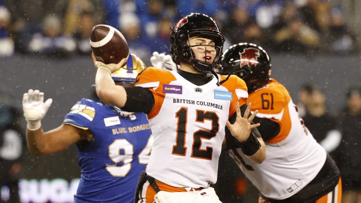 Nov 13, 2022; Winnigeg, Manitoba, CAN; BC Lions quarterback Nathan Rourke (12) throws against the Winnipeg Blue Bombers in the first half at Investors Group Field. Mandatory Credit: James Carey Lauder-USA TODAY Sports