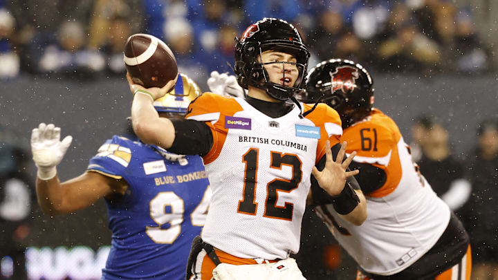 Nov 13, 2022; Winnigeg, Manitoba, CAN; BC Lions quarterback Nathan Rourke (12) throws against the Winnipeg Blue Bombers in the first half at Investors Group Field. Mandatory Credit: James Carey Lauder-Imagn Images